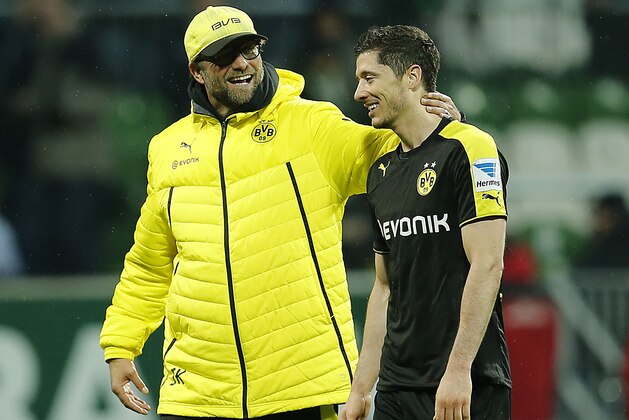 Dortmund head coach Juergen Klopp, left, and Dortmund's Robert Lewandowski of Poland are all smile after winning  the German first division Bundesliga soccer match between Werder Bremen and Borussia Dortmund in Bremen, Germany, Saturday, Feb. 8, 2014. (AP Photo/Frank Augstein)