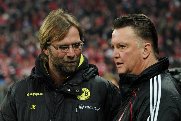 RESTRICTIONS / EMBARGO - ONLINE CLIENTS MAY USE UP TO SIX IMAGES DURING EACH MATCH WITHOUT THE AUTHORISATION OF THE DFL. NO MOBILE USE DURING THE MATCH AND FOR A FURTHER TWO HOURS AFTERWARDS IS PERMITTED WITHOUT THE AUTHORISATION OF THE DFL.Bayern Munich's Dutch head coach Louis van Gaal (R) and Dortmund's Dortmund's head coach Juergen Klopp greet each other as they arrive for the German first division Bundesliga football match FC Bayern Munich vs Borussia Dortmund in the southern German city of Munich on February 26, 2011. AFP PHOTO / CHRISTOF STACHE FC Bayern Munich vs Borussia Dortmund in the southern German city of Munich on February 26, 2011. AFP PHOTO / CHRISTOF STACHE (Photo credit should read CHRISTOF STACHE/AFP/Getty Images)
