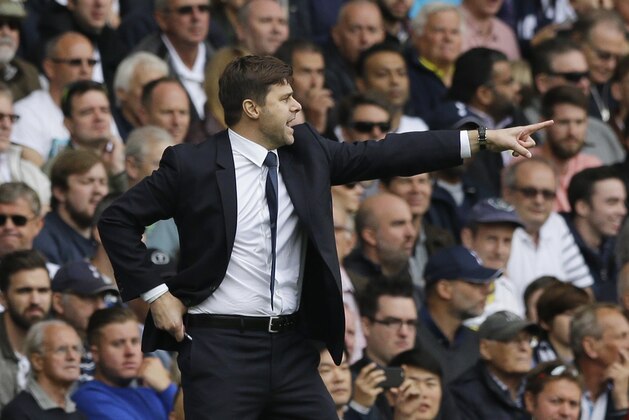 Tottenham Hotspur's head coach Mauricio Pochettino shouts instructions,  during the English Premier League soccer match between Tottenham Hotspur and Manchester City at White Hart Lane stadium in London, Saturday, Sept. 26, 2015.  (AP Photo/Matt Dunham)