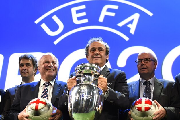 English Football Association Chairman Greg Dyke (L) stands by UEFA President Michel Platini after London were chosen to host the final and semi-finals of the 2020 UEFA European championship in Geneva on September 19, 2014. European football's governing body is picking 13 countries who will host football matches for the tournament. For the 60th anniversary of the European Championship, first held in 1960, UEFA decided to organise the tournament across the whole continent. 
 AFP PHOTO / FABRICE COFFRINI        (Photo credit should read FABRICE COFFRINI/AFP/Getty Images)