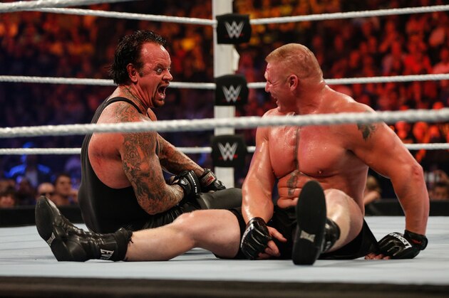 NEW YORK, NY - AUGUST 23:  Brock Lesnar and The Undertaker battle it out at the WWE SummerSlam 2015 at Barclays Center of Brooklyn on August 23, 2015 in New York City.  (Photo by JP Yim/Getty Images)