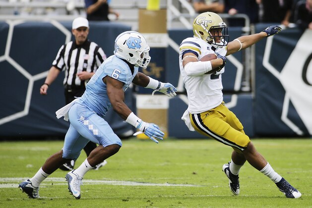 Georgia Tech's Ricky Jeune, right, is chased by North Carolina's M.J. Stewart in the second quarter of an NCAA college football game Saturday, Oct. 3, 2015, in Atlanta. North Carolina won 38-31. (AP Photo/David Goldman)