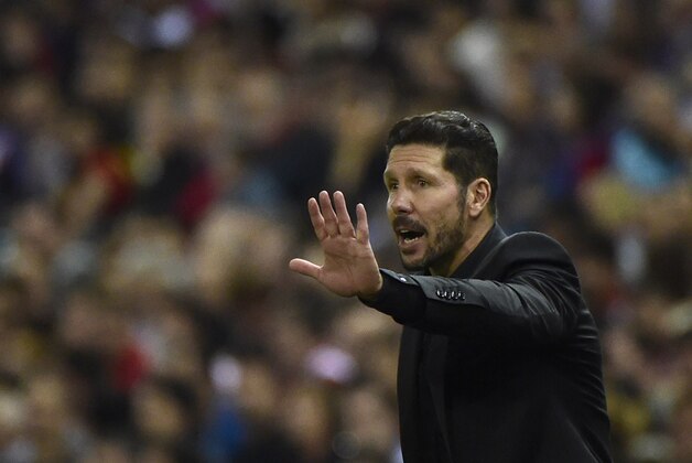 Atletico Madrid's Argentinian coach Diego Simeone gestures during the Spanish league football match Club Atletico de Madrid vs Real Madrid CF at the Vicente Calderon stadium in Madrid on October 4, 2015.   AFP PHOTO/ PIERRE-PHILIPPE MARCOU        (Photo credit should read PIERRE-PHILIPPE MARCOU/AFP/Getty Images)
