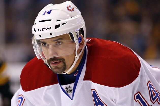 Montreal Canadiens' Tomas Plekanec waits for a face off against the Boston Bruins during the first period of an NHL hockey game in Boston Saturday, Nov. 22, 2014. (AP Photo/Winslow Townson)