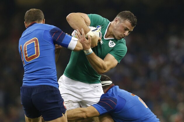 Ireland's Robbie Henshaw, centre, is tackled during the Rugby World Cup Pool D match between France and Ireland at the Millennium Stadium in Cardiff, Wales, Sunday, Oct. 11, 2015. (AP Photo/Alastair Grant)