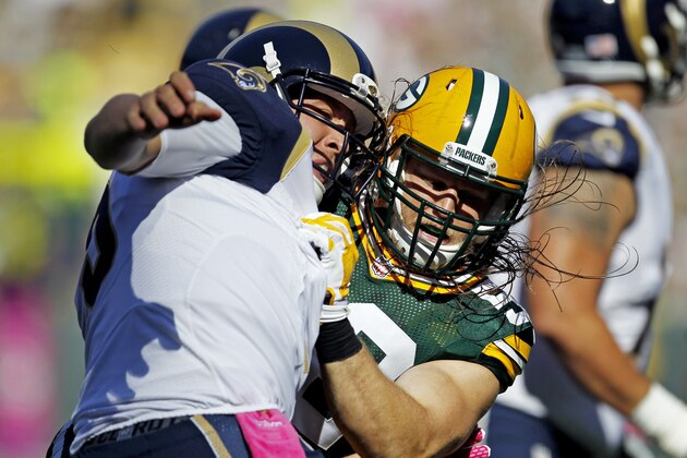 Green Bay Packers' Clay Matthews nearly sacks St. Louis Rams' Nick Foles during the first half an NFL football game Sunday, Oct. 11, 2015, in Green Bay, Wis. (AP Photo/Matt Ludtke)
