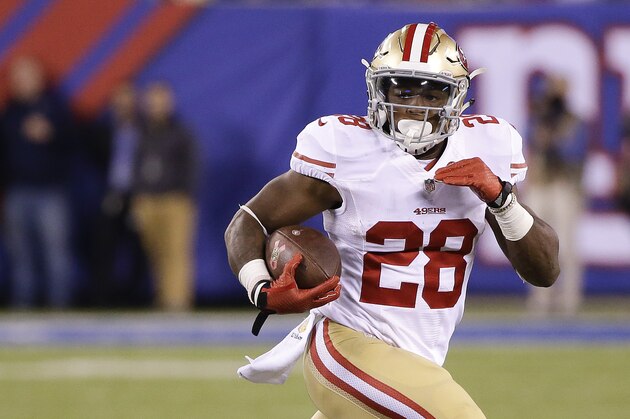 San Francisco 49ers running back Carlos Hyde (28) runs the ball against the New York Giants during the fourth quarter of an NFL football game, Sunday, Oct. 11, 2015, in East Rutherford, N.J. (AP Photo/Seth Wenig)