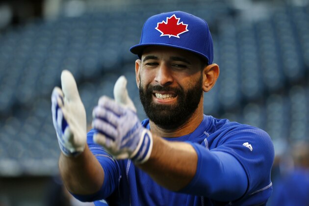 Toronto Blue Jays right fielder Jose Bautista warms up before Game 1 of baseball's American League Championship Series against the Kansas City Royals on Friday, Oct. 16, 2015, in Kansas City, Mo. (AP Photo/Paul Sancya)