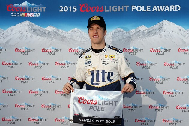KANSAS CITY, KS - OCTOBER 16:  Brad Keselowski, driver of the #2 Miller Lite Ford, poses with the Coors Light Pole Award after qualifying for the pole position for the NASCAR Sprint Cup Series Hollywood Casino 400 at Kansas Speedway on October 16, 2015 in Kansas City, Kansas.  (Photo by Todd Warshaw/Getty Images)