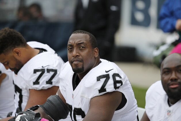 Oakland Raiders offensive guard J'Marcus Webb (76) watches from the bench during the first half of an NFL football game against the Chicago Bears, Sunday, Oct. 4, 2015, in Chicago. (AP Photo/Charles Rex Arbogast)