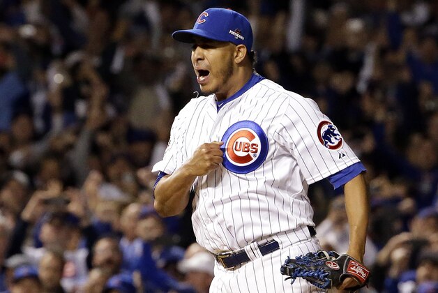 Chicago Cubs relief pitcher Hector Rondon (56) celebrates after striking out St. Louis Cardinals left fielder Stephen Piscotty (55) to win Game 4 in baseball's National League Division Series, Tuesday, Oct. 13, 2015, in Chicago. The Cubs won 4-6. (AP Photo/Nam Y. Huh)