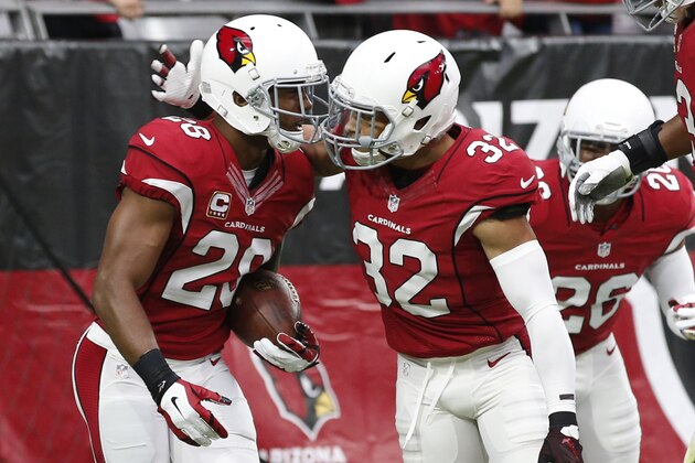 Arizona Cardinals cornerback Justin Bethel (28) celebrates his interception for a touchdown with Tyrann Mathieu (32) against the San Francisco 49ers during the first half of an NFL football game against the, Sunday, Sept. 27, 2015, in Glendale, Ariz.  (AP Photo/Ross D. Franklin)