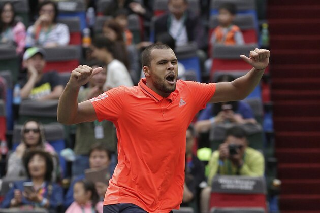 Jo-Wilfried Tsonga of France celebrates after defeated Kevin Anderson of South Africa in the quarterfinal match of the Shanghai Masters tennis tournament in Shanghai, China, Friday, Oct. 16, 2015. (AP Photo/Andy Wong)