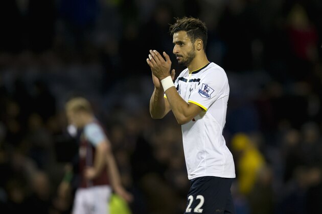 Tottenham's Nacer Chadli applauds supporters after his team's 1-1 draw at Burnley during their English FA Cup third round soccer match at Turf Moor Stadium, Burnley, England, Monday Jan. 5 2015. (AP Photo/Jon Super)