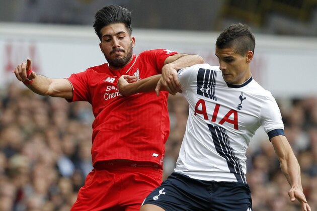 Tottenham Hotspur's Argentinian midfielder Erik Lamela (R) vies with Liverpool's German midfielder Emre Can during the English Premier League football match between Tottenham Hotspur and Liverpool at White Hart Lane in north London on October 17, 2015. AFP PHOTO / IAN KINGTON

RESTRICTED TO EDITORIAL USE. No use with unauthorized audio, video, data, fixture lists, club/league logos or 'live' services. Online in-match use limited to 75 images, no video emulation. No use in betting, games or single club/league/player publications.        (Photo credit should read IAN KINGTON/AFP/Getty Images)