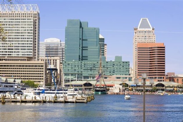 Buildings at the waterfront, Inner Harbor, Baltimore, Maryland, USA (Glow Images via AP Images)