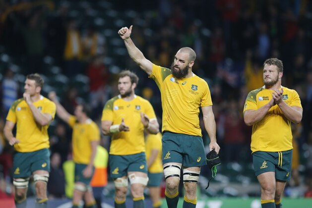 Australia players gesture the crowd after the Rugby World Cup Pool A match between Australia and Wales at Twickenham Stadium, London, Saturday, Oct. 10, 2015. Australia won the match 15-6.  (AP Photo/Frank Augstein)