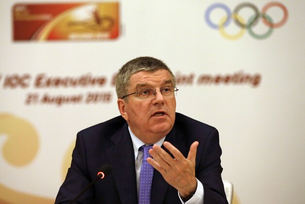 IOC president Thomas Bach gestures during a joint IOC and IAAF press conference on the side of the World Athletic Championships in Beijing, Friday, Aug. 21, 2015. (AP Photo/Kin Cheung)