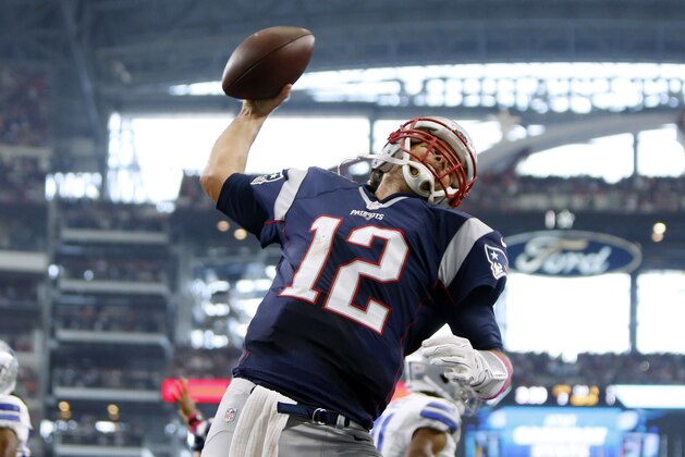 Oct 11, 2015; Arlington, TX, USA; New England Patriots quarterback Tom Brady (12) celebrates scoring a touchdown against the Dallas Cowboys at AT&T Stadium. Mandatory Credit: Erich Schlegel-USA TODAY Sports