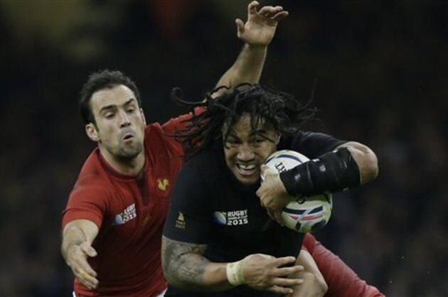 New Zealand's Ma'a Nonu is tackled by France's Brice Dulin and Morgan Parra, left, during the Rugby World Cup quarterfinal match between New Zealand and France at the Millennium Stadium, Cardiff, Saturday, Oct. 17, 2015. (AP Photo/Tim Ireland)