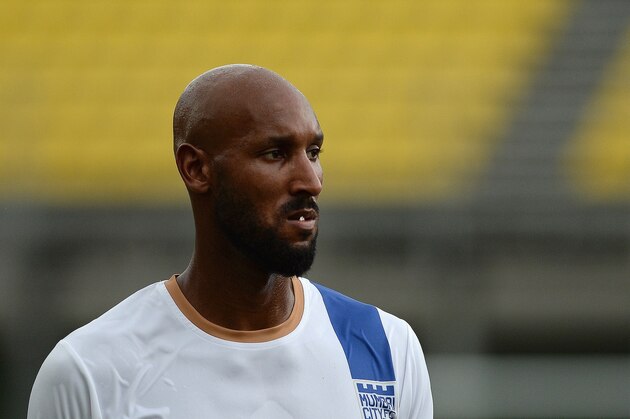 To go with story 'India-football-media-entertainment' by Trudy HARRIS

In this photograph taken on October 1, 2014 French football striker Nicolas Anelka participates in a training session of Mumbai City Football Club team at Cooperage Ground in Mumbai.  With Bollywood stars, cricketing greats and a slick marketing campaign, India's new football league is gunning to become the next big thing in sport.  But just days before the kick off on October 12, 2014 in the eastern city of Kolkata, the Indian Super League (ISL), which has lured a host of former international stars, is facing a barrage of scepticism.   AFP PHOTO/ PUNIT PARANJPE        (Photo credit should read PUNIT PARANJPE/AFP/Getty Images)