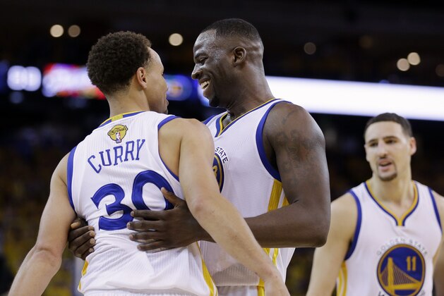 FILE In this file photo from Sunday, June 14, 2015, Golden State Warriors guard Stephen Curry (30) celebrates with forward Draymond Green, center, and guard Klay Thompson (11) after Game 5 of basketball's NBA Finals against the Cleveland Cavaliers in Oakland, Calif. (AP Photo/Ben Margot)