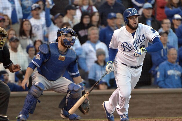 Oct 17, 2015; Kansas City, MO, USA; Kansas City Royals third baseman Mike Moustakas (8) hits an RBI during the eighth inning against the Toronto Blue Jays in game two of the ALCS at Kauffman Stadium. Mandatory Credit: Denny Medley-USA TODAY Sports