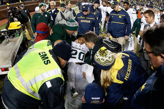 ANN ARBOR, MI - OCTOBER 17:  Defensive back Jalen Watts-Jackson #20 of the Michigan State Spartans is lifted onto a stretcher after being injured on his game winning 38 yard touchdown against the Michigan Wolverines following the college football game at Michigan Stadium on October 17, 2015 in Ann Arbor, Michigan. The Spartans defeated the Wolverines 27-23.  (Photo by Christian Petersen/Getty Images)