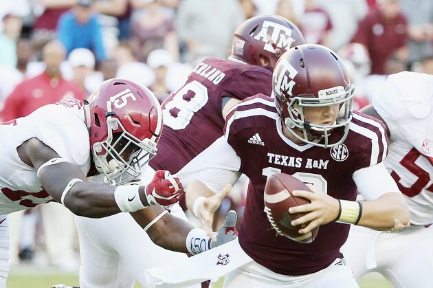 COLLEGE STATION, TX - OCTOBER 17:  Ronnie Harrison #15 of the Alabama Crimson Tide tackles Kyle Allen #10 of the Texas A&M Aggies in the second half of their game at Kyle Field on October 17, 2015 in College Station, Texas.  (Photo by Scott Halleran/Getty Images)