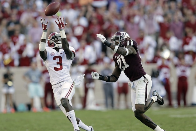 Alabama 's Calvin Ridley (3) pulls in a pass for a first down as Texas A&M 's Brandon Williams (21) defends him during the second half of an NCAA college football game, Saturday, Oct. 17, 2015, in College Station, Texas. Alabama won 41-23. (AP Photo/Eric Gay)