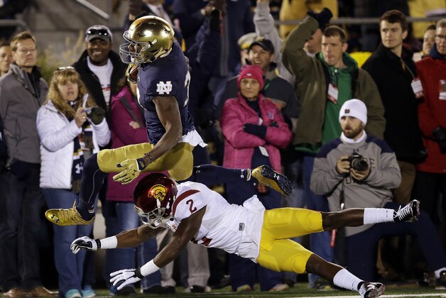Notre Dame's Josh Adams (33) is tackled by Southern California's Adoree' Jackson (2) during the first half of an NCAA college football game Saturday, Oct. 17, 2015, in South Bend, Ind.  (AP Photo/Darron Cummings)