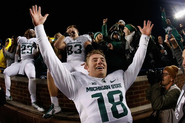 ANN ARBOR, MI - OCTOBER 17:  Quarterback Connor Cook #18 of the Michigan State Spartans celebrates after defeating the Michigan Wolverines 27-23 in the college football game at Michigan Stadium on October 17, 2015 in Ann Arbor, Michigan.  (Photo by Christian Petersen/Getty Images)