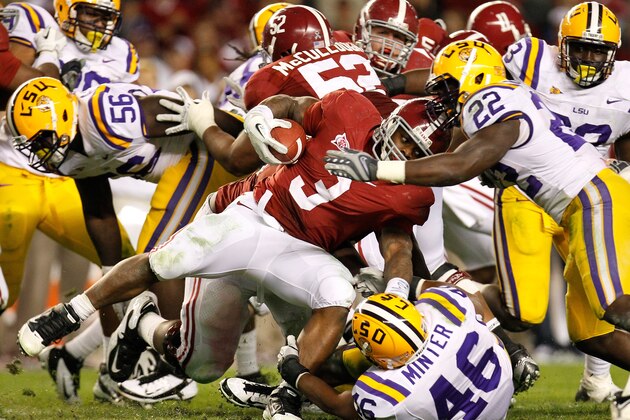 TUSCALOOSA, AL - NOVEMBER 05:  Trent Richardson #3 of the Alabama Crimson Tide against Ryan Baker #22 and Kevin Minter #46 of the LSU Tigers at Bryant-Denny Stadium on November 5, 2011 in Tuscaloosa, Alabama.  (Photo by Kevin C. Cox/Getty Images)