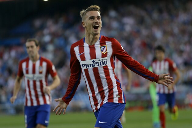 Atletico Madrid's Antoine Griezmann celebrates after scoring the opening goal against Getafe during a Spanish La Liga soccer match between Atletico Madrid and Getafe at the Vicente Calderon in Madrid, Tuesday, Sept. 22, 2015. (AP Photo/Francisco Seco)