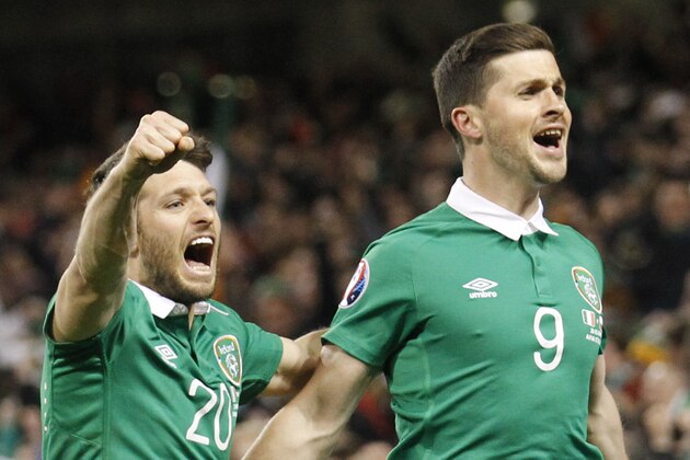 Republic of Ireland's Shane Long, right, celebrates scoring against Poland with Wesley Hoolahan during their Euro 2016 Group D qualifying soccer match at the Aviva stadium, Dublin, Ireland, Sunday, March 29, 2015.  (AP Photo/Peter Morrison)