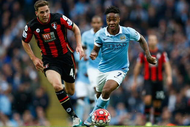 MANCHESTER, ENGLAND - OCTOBER 17: Raheem Sterling of Manchester City and Dan Gosling of Bournemouth compete for the ball during the Barclays Premier League match between Manchester City and A.F.C. Bournemouth at Etihad Stadium on October 17, 2015 in Manchester, England.  (Photo by Dean Mouhtaropoulos/Getty Images)