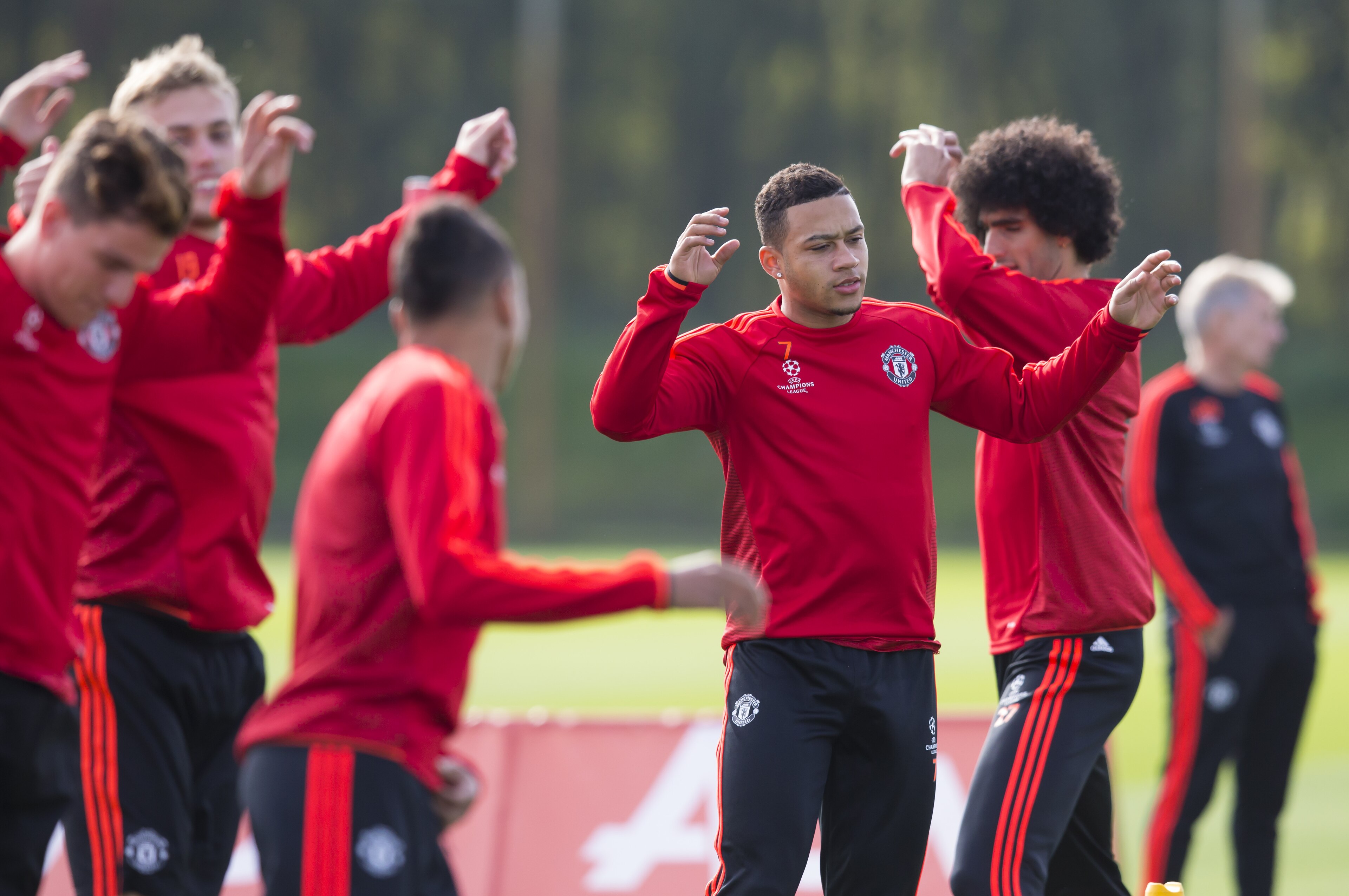 Manchester United's Memphis Depay, cenre right, trains with teammates at Carrington training ground in Manchester, England, Tuesday, Sept. 29, 2015. Manchester United will play at VFL Wolfsberg in a Champions League group B soccer match on Wednesday. (AP Photo/Jon Super) Manchester United's Memphis Depay, cenre right, trains with teammates at Carrington training ground in Manchester, England, Tuesday, Sept. 29, 2015. Manchester United will play at VFL Wolfsberg in a Champions League group B soccer match on Wednesday. (AP Photo/Jon Super)