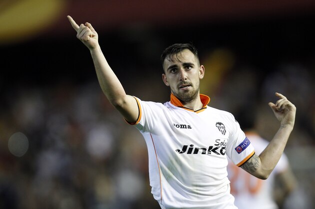 Valencia’s Paco Alcacer celebrates after scoring against Basel during the Europa League quarterfinal, second leg soccer match at the Mestalla stadium in Valencia, Spain, on Thursday, April 10, 2014. Valencia lost 3-0 in the first leg at Basel. (AP Photo/Alberto Saiz)
