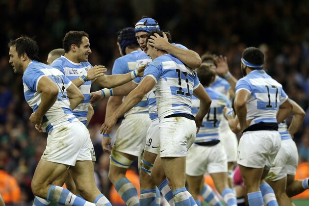 Argentina players celebrate winning the Rugby World Cup quarterfinal match between Ireland and Argentina at the Millennium Stadium, Cardiff, Sunday, Oct. 18, 2015. Argentina won the match 20-43. (AP Photo/Tim Ireland)