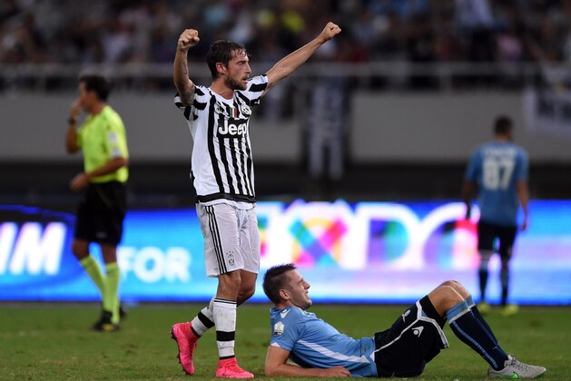 Juventus Italian midfielder Claudio Marchisio celebrates his teams victory after the Italian Super Cup final football match between Juventus and Lazio in Shanghai on August 8, 2015. Juventus defeated Lazio 2:0.
AFP PHOTO / JOHANNES EISELE        (Photo credit should read JOHANNES EISELE/AFP/Getty Images)