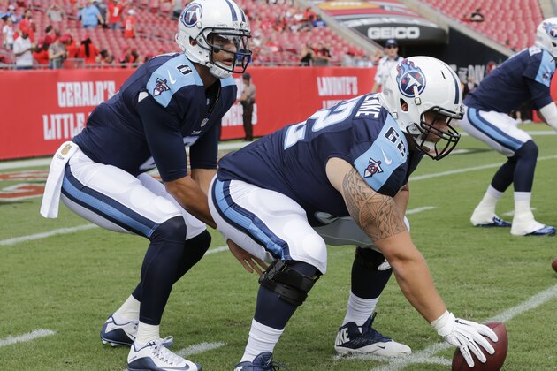 Tennessee Titans quarterback Marcus Mariota (8) and  center Brian Schwenke (62) warm up before an NFL football game, Sunday, Sept. 13, 2015, in Tampa, Fla. (AP Photo/Chris O'Meara)