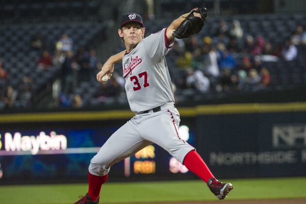 Washington Nationals' Stephen Strasburg pitches against the Atlanta Braves during the first inning of a baseball game, Thursday, Oct. 1, 2015, in Atlanta. (AP Photo/John Amis)