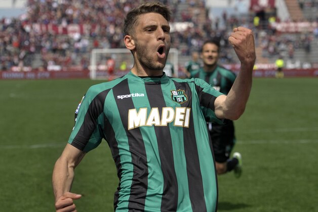 Sassuolo's Domenico Berardi celebrates after scoring a goal during their Serie A soccer match against Torino, at Reggio Emilia's Mapei stadium, Italy, Sunday, April 19, 2015. (AP Photo/Marco Vasini)