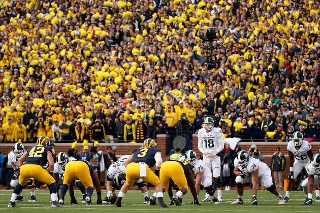 ANN ARBOR, MI - OCTOBER 17:  Quarterback Connor Cook #18 of the Michigan State Spartans prepares to snap the football during the third quarter of the college football game against the Michigan Wolverines at Michigan Stadium on October 17, 2015 in Ann Arbor, Michigan.  The Spartans defeated the Wolverines 27-23.  (Photo by Christian Petersen/Getty Images)