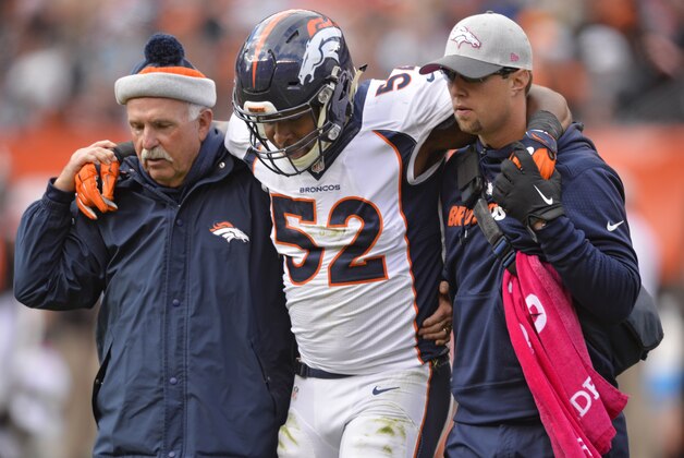 Denver Broncos outside linebacker Corey Nelson (52) is helped off the field during the second half of an NFL football game against the Cleveland Browns, Sunday, Oct. 18, 2015, in Cleveland. (AP Photo/David Richard)