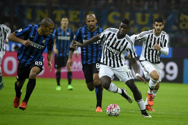 Juventus' midfielder from France Paul Pogba (R) fights for the ball with Inter Milan's defender from Brazil Joao Miranda during the Italian Serie A football match Inter Milan vs Juventus on October18, 2015 at the San Siro Stadium stadium in Milan. AFP PHOTO / OLIVIER MORIN        (Photo credit should read OLIVIER MORIN/AFP/Getty Images)