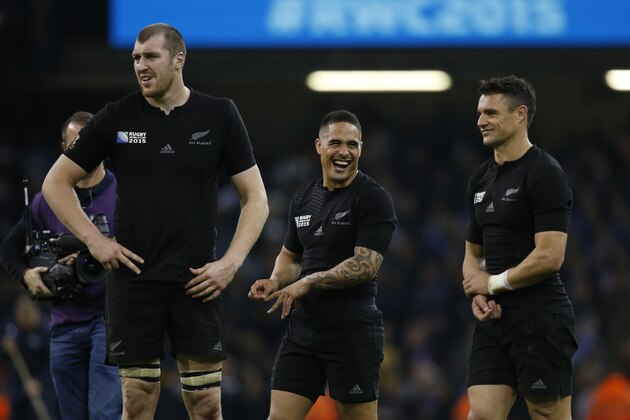 New Zealand players celebrate winning the Rugby World Cup quarterfinal match between New Zealand and France at the Millennium Stadium, Cardiff, Saturday, Oct. 17, 2015. New Zealand won the match 62-13. (AP Photo/Alastair Grant)