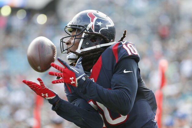 Houston Texans wide receiver DeAndre Hopkins (10) makes a catch for a 26-yard touchdown against the Jacksonville Jaguars during the second half of an NFL football game in Jacksonville, Fla., Sunday, Oct. 18, 2015. (AP Photo/Stephen B. Morton)