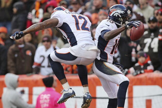 Denver Broncos wide receiver Emmanuel Sanders (10) and Andre Caldwell (12) celebrate after Sanders scored during the second half of an NFL football game against the Cleveland Browns, Sunday, Oct. 18, 2015, in Cleveland. (AP Photo/Aaron Josefczyk) Denver Broncos wide receiver Emmanuel Sanders (10) and Andre Caldwell (12) celebrate after Sanders scored during the second half of an NFL football game against the Cleveland Browns, Sunday, Oct. 18, 2015, in Cleveland. (AP Photo/Aaron Josefczyk)