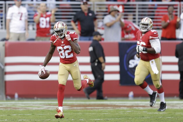 San Francisco 49ers wide receiver Torrey Smith (82) celebrates after scoring on a 76-yard touchdown reception against the Baltimore Ravens during the first half of an NFL football game in Santa Clara, Calif., Sunday, Oct. 18, 2015. (AP Photo/Ben Margot)